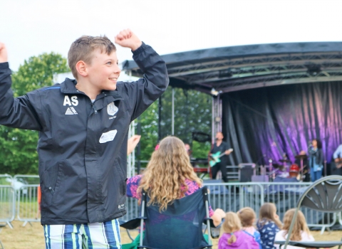 CamWild Boy dancing in front of stage