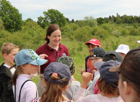 Debbie at Paxton Pits with a group of children 