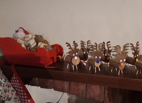 Reindeer made from corks and matchsticks pulling a sleigh