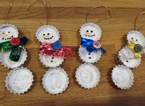 Recycled bottle tops made into snowmen decorations