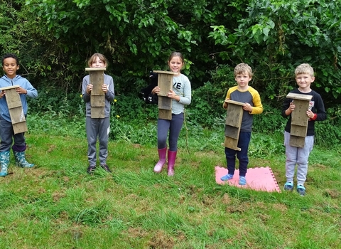The Great Fen Wildlife Watch group with the bat boxes they made
