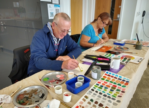 People Painting at a Nature Journaling Workshop