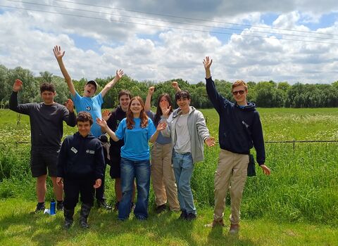Young People's Forum members standing in the garden at Strawberry Hill